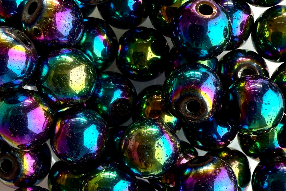 Facettierte Hämatit-Perlen mit regenbogenfarbener Beschichtung – glänzend, rund und intensiv reflektierend