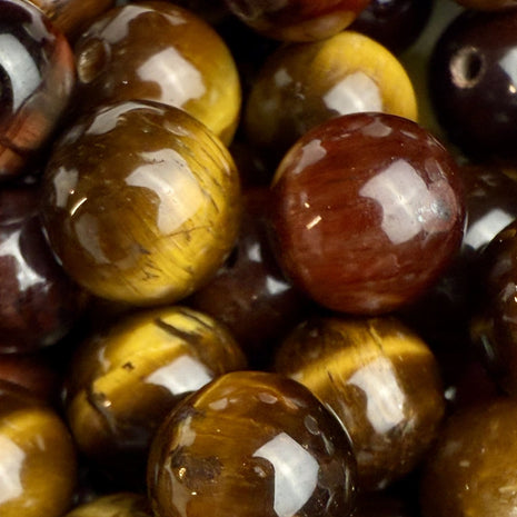 Tigerauge-Perlen, natürliche Quarzvarietät mit schimmerndem Effekt in Goldgelb- bis Brauntönen, erhältlich im ‚Style it yourself‘-Angebot von Elurea. Ideal für individuellen Schmuck.